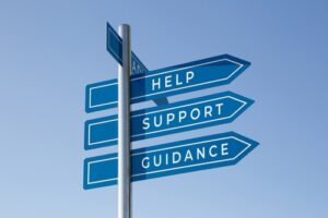 Signpost with Help, Support, and Guidance arrows